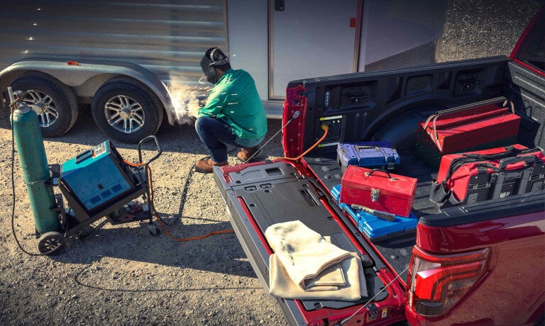2026 Ford F-150 with bed open powering welding equipment